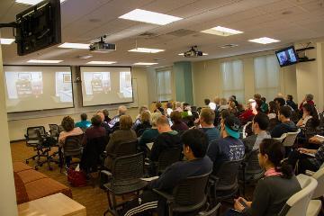 A large group of people in a conference room.