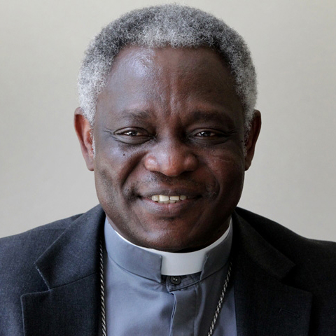 A smiling man in clerical attire.