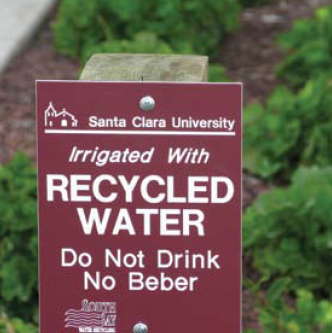 Sign reads: Santa Clara University Irrigated With RECYCLED WATER Do Not Drink No Beber. image link to story