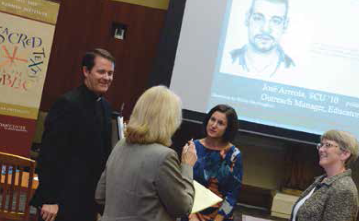 Four people engaging, screen showing a mustache illustration and some text.