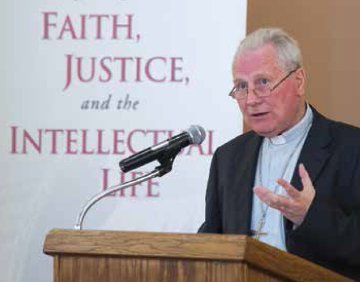 A person speaking at a podium with a microphone.