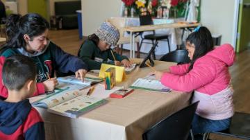 Beleny Qiroz 26 with students in iPad program
