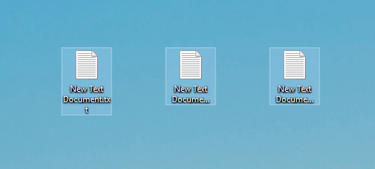 A screenshot of the Windows 10 desktop showing three text document icons, all starting with New Text Document...