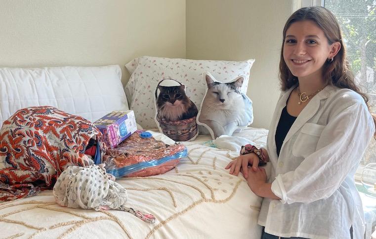 Giovanna Esposito '26 and her cat pillows in her room at Dunne Residence Hall.