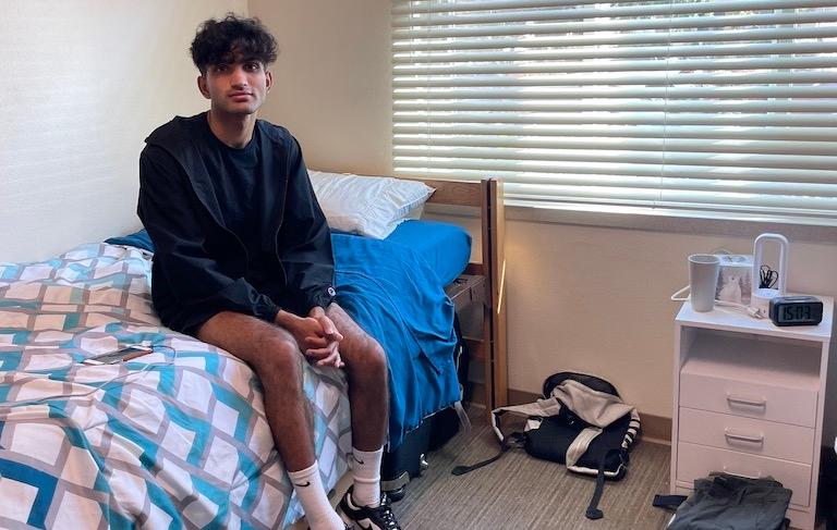 Ananth Menon '26 relaxes in his room at Dunne Residence Hall.
