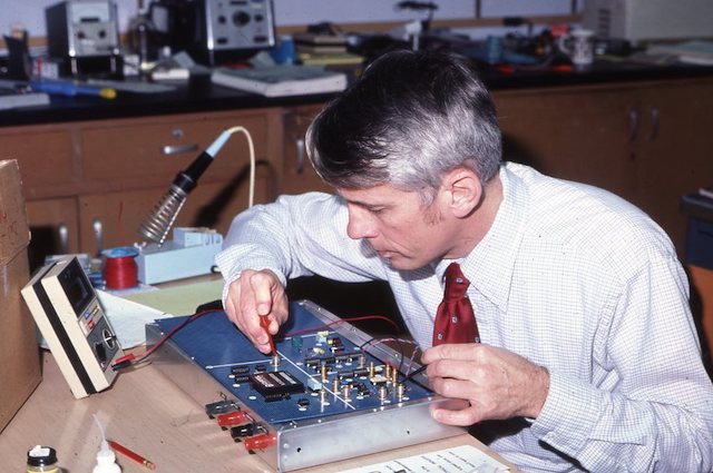 Working on an electrical board. Photo courtesy SCU Archives.