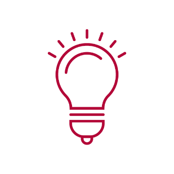 Icon of a red light bulb with rays emanating outward.