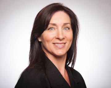 A person smiling in a professional headshot.