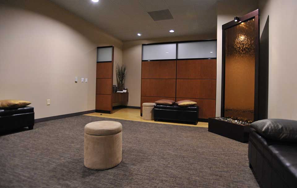 A peaceful meditation room with cushions and soft lighting.