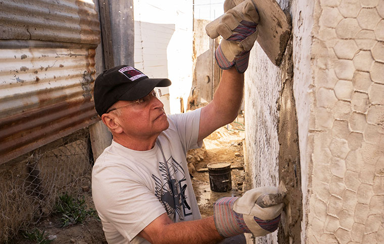 Fr. Reites helping to build houses in Mexico 