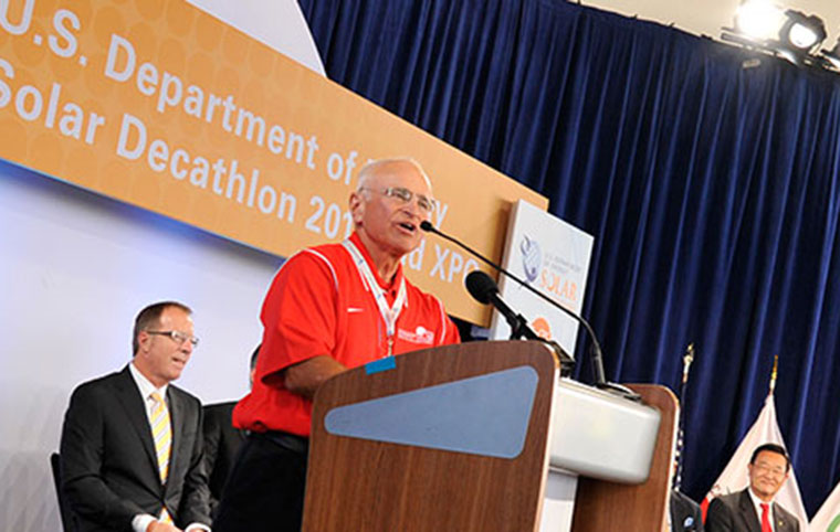 Fr. Reites speaking at the 2013 Solar Decathlon 