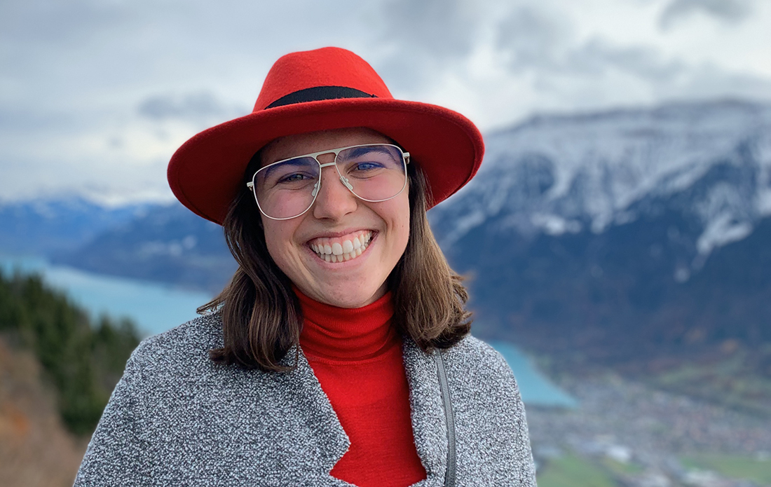 Ann Codiga standing in front of scenic mountain range