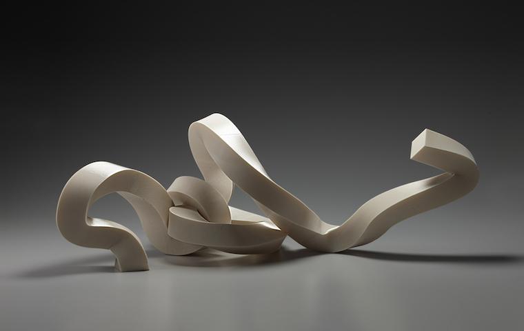 Abstract sculpture titled Coriolis with organic, curving shapes.