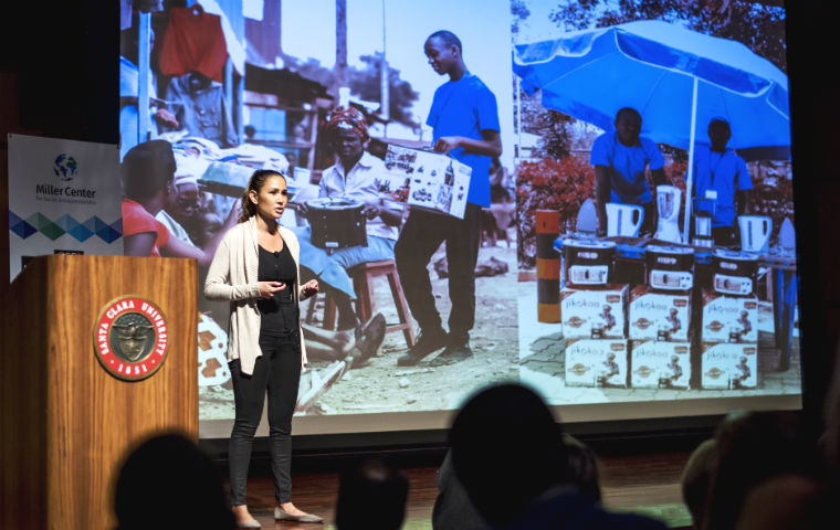 A woman on stage at the GSBI investor showcase 2016 image link to story