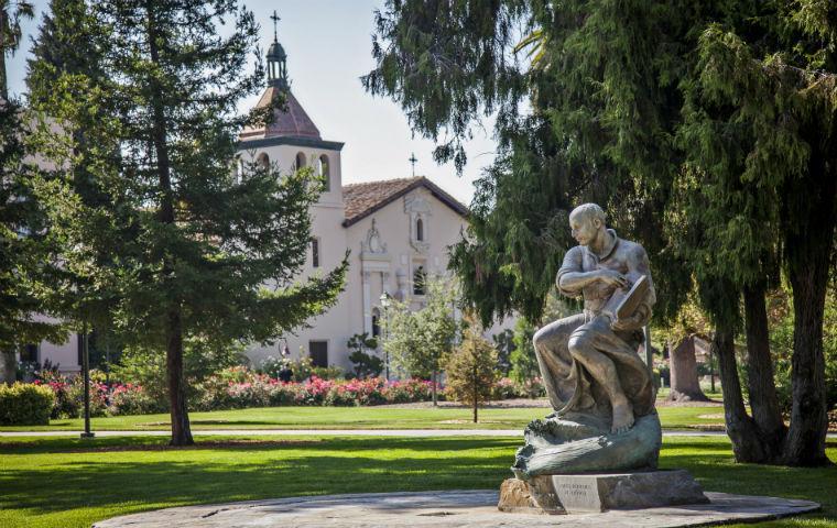 Photo of St. Ignatius statue w/ Mission Church in background