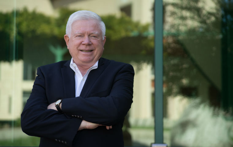 Photo of Markkula E.D. Kirk Hanson outside with arms crossed image link to story