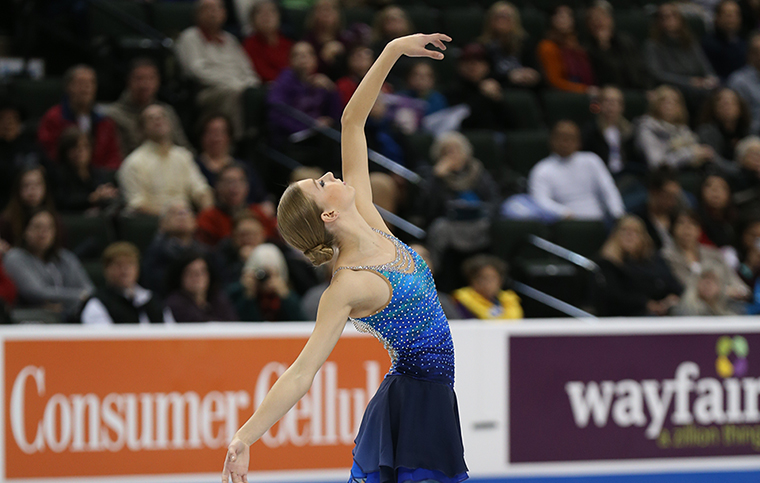 Figure skater Polina Edmunds poses on the ice