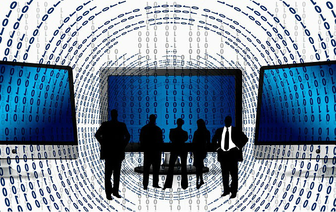 Graphic of professional people silhouetted against digital coding and computers