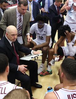 Coach Sendek huddles with players during SCU-Portland game.