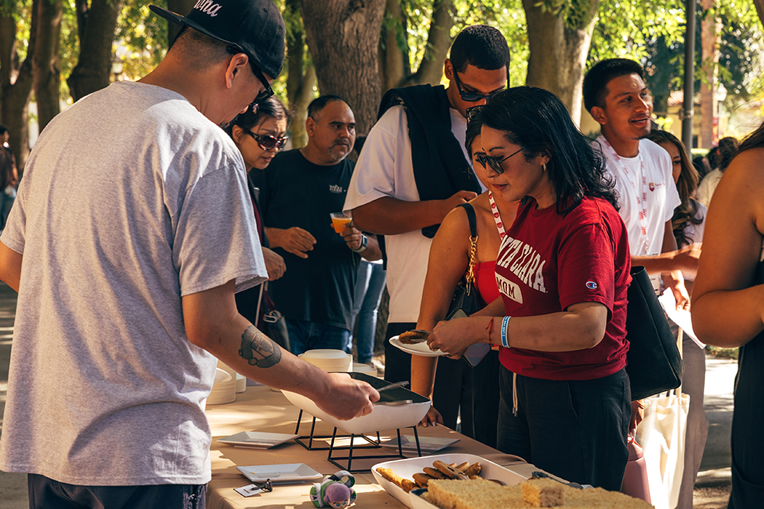Line of parents getting food at a buffet at LEAD Move-In Weekend