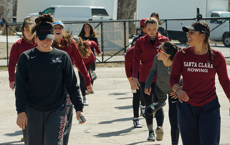 Two lines of women rowers approaching the camera