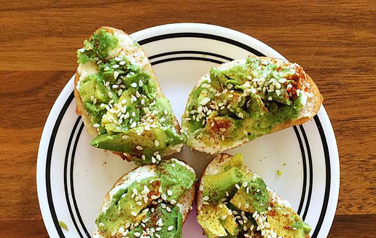 Four pieces of avocado toast on a plate image link to story