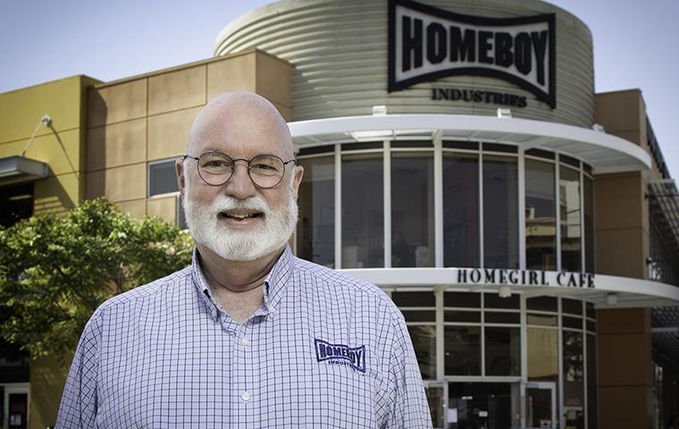 Greg Boyle, S.J. photo in front of Homeboy Industries building image link to story