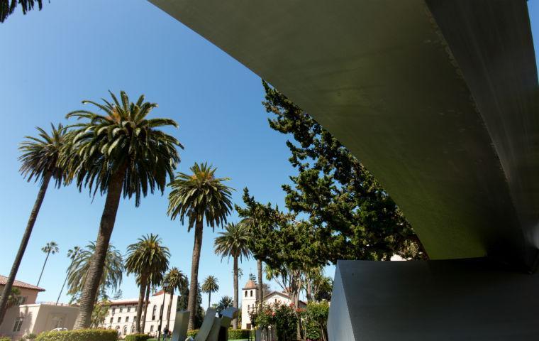 Campus Cube sculpture with building in background image link to story