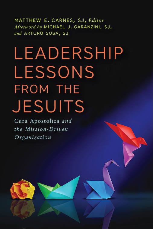 Book cover featuring a crumpled paper becoming origami birds.