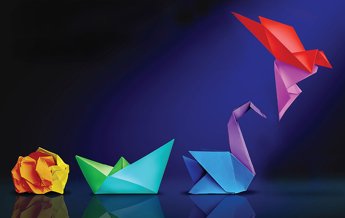 A 3D illustration of crumpled paper turning into origami birds.