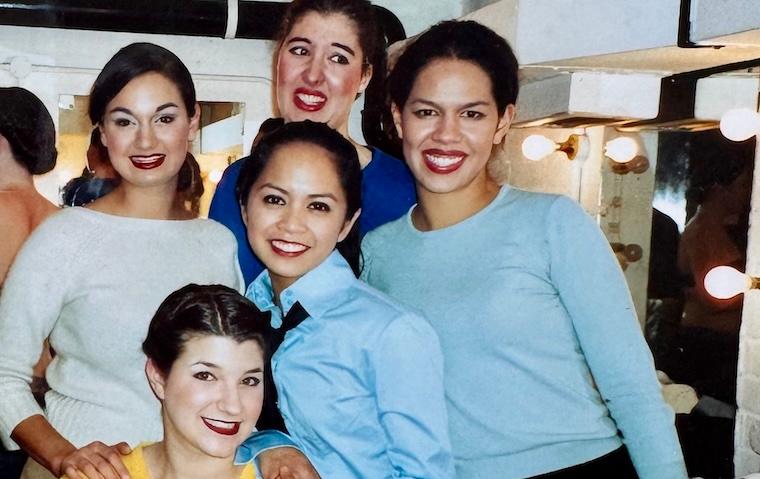 Amielynn Abellera and four female cast mates pose backstage.