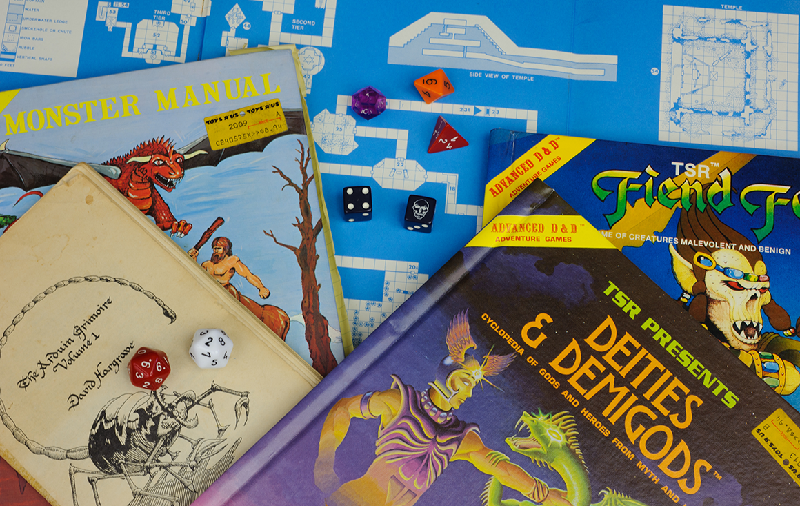 A collection of vintage Dungeons & Dragons manuals and scattered dice.