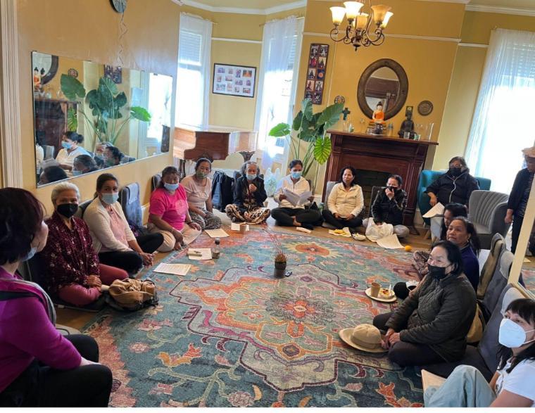 A photo of Oakland community members discussing public safety plans.