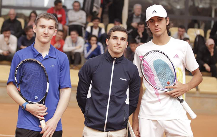 Guillaume Dalmasso (right) and two other tennis players at a tournament