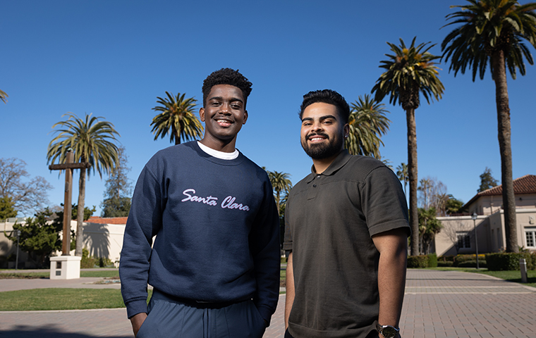 Niyibitanga Inosa ’23 and Antonio Magallanes ’23 stand in front of palm trees on Santa Clara's campus image link to story