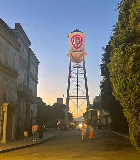 A sunset photo down a studio lot looking at the Warner Bros. water tower.