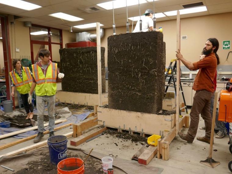 Cob test walls under construction by students in SCU lab, along with CRI board member Anthony Dente (far right).                                                                           board membe. First on Ant image link to story
