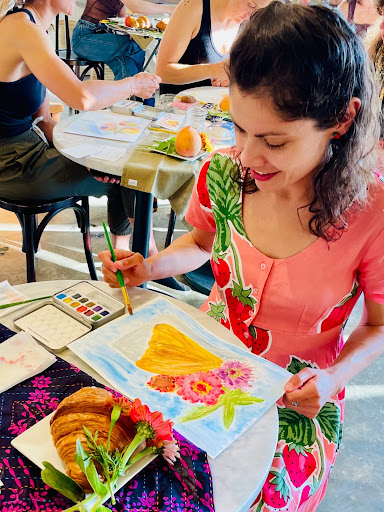 Jesica trying to paint with watercolors—and feeling joy.