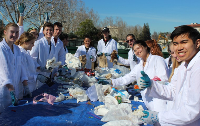 Students in sustainability conducting waste characterization study