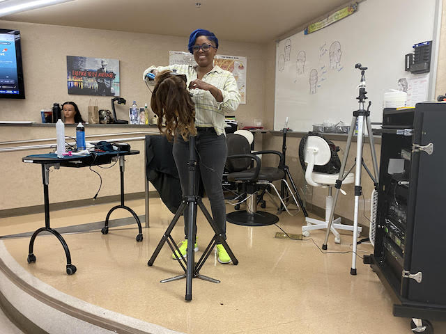 Tanesha pictured at San Jose City College, where she is a substitute hairstyling instructor.