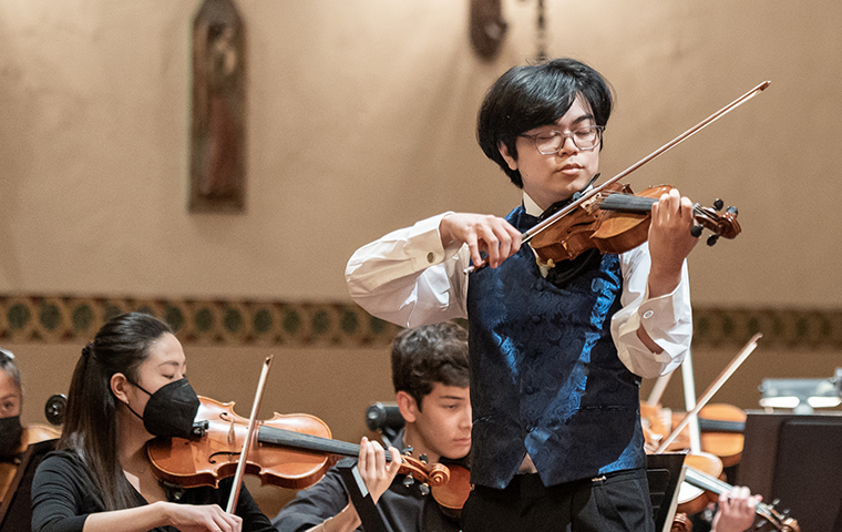Tyler Ikehara performs with the SCU orchestra as part of the Concerto and Aria Competition. Photo by Adam Hays