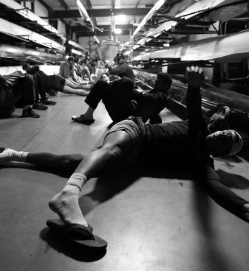 SCU Men's rowing team stretching before practice