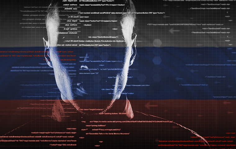 Hacker outline sits in front of screen with Russian flag image link to story