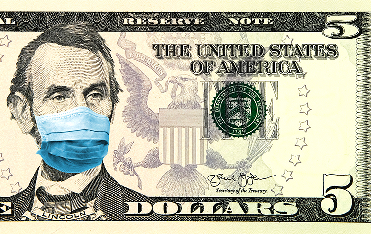 Five dollar bill with medical mask on Abraham Lincoln.