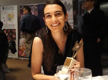 Marialisa Caruso holding the award for Best Supporting Actress at the Milan International Filmmaker Festival 2019