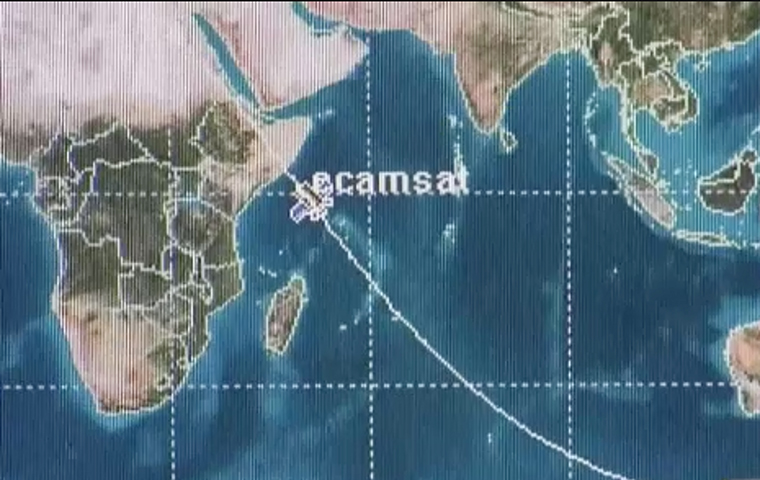 A graphic image of a NASA satellite floating over a map