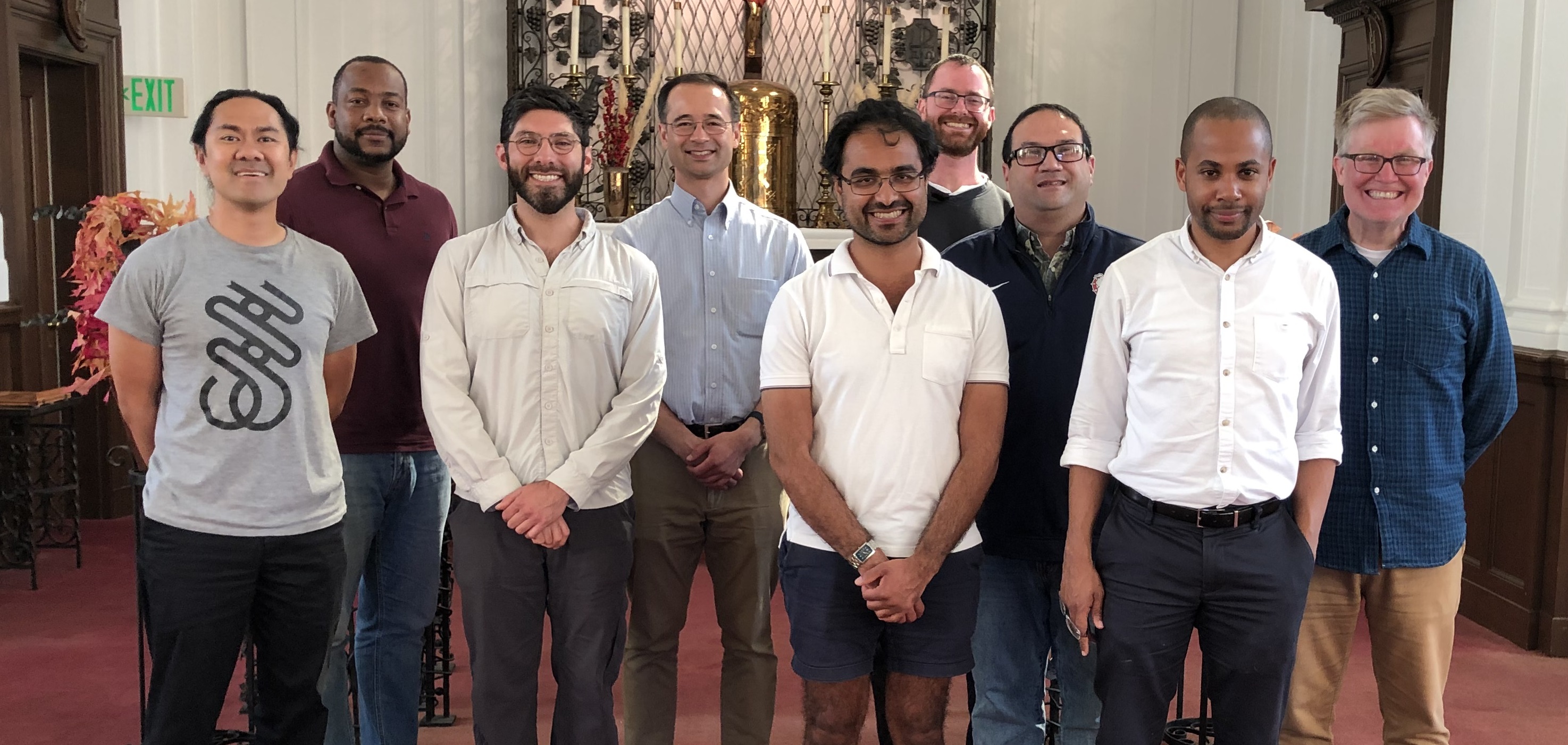 A group of men standing together in a church.