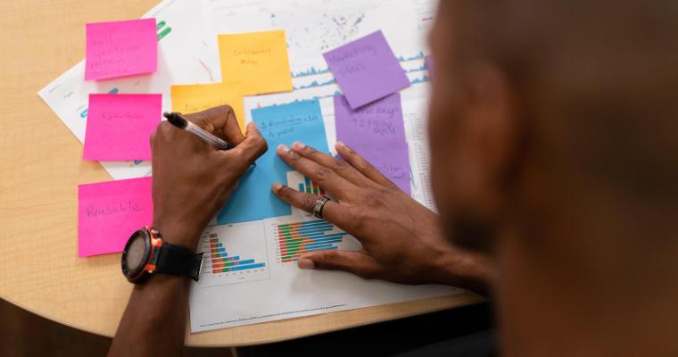 Student studying with bright colored note cards