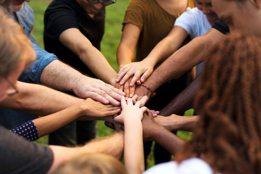 Hands together for a team huddle