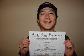 Cory Hiromoto pictured with his diploma